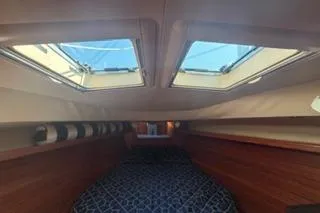 Slide: The Image of Interior cabin of 2009 Hunter 50 Center Cockpit sailboat with skylights and cozy bedding. - 28