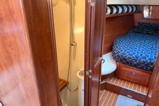 Slide: The Image of 2009 Hunter 50 Center Cockpit interior with cozy cabin and compact bathroom. - 30