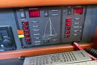 Slide: The Image of Control panel of a 2009 Hunter 50 Center Cockpit sailboat with remote. - 32