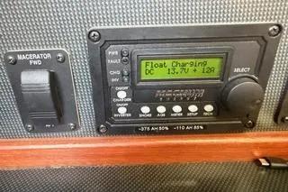 Slide: The Image of Control panel of a 2009 Hunter 50 Center Cockpit boat, displaying charging status. - 33