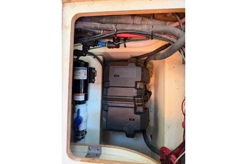 Slide: The Image of Electrical compartment of 2009 Hunter 50 Center Cockpit sailboat, showing wiring and components. - 38