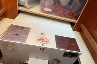 Slide: The Image of 2009 Hunter 50 Center Cockpit interior storage with equipment and supplies. - 39