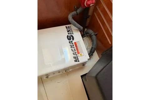 Slide: The Image of 2009 Hunter 50 Center Cockpit boat interior with machinery and wiring. - 40