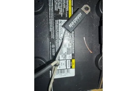 Slide: The Image of Battery with wiring and label on a 2009 Hunter 50 Center Cockpit. - 41