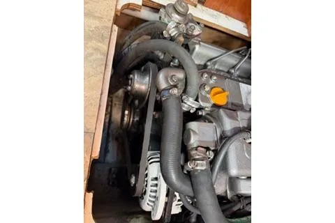 Slide: The Image of Engine compartment of 2009 Hunter 50 Center Cockpit sailboat, showing belts and hoses. - 44