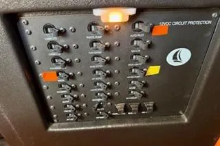 Slide: The Image of Electrical panel of 2009 Hunter 50 Center Cockpit yacht with circuit protection switches. - 45