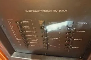 Slide: The Image of Electrical panel of 2009 Hunter 50 Center Cockpit boat, showing circuit protection switches. - 46