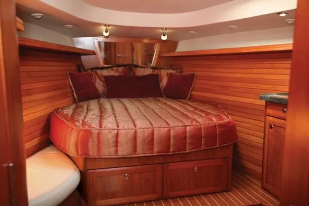 Slide: The Image of 2009 Hunter 50 Center Cockpit yacht docked in a marina with other boats. - 6