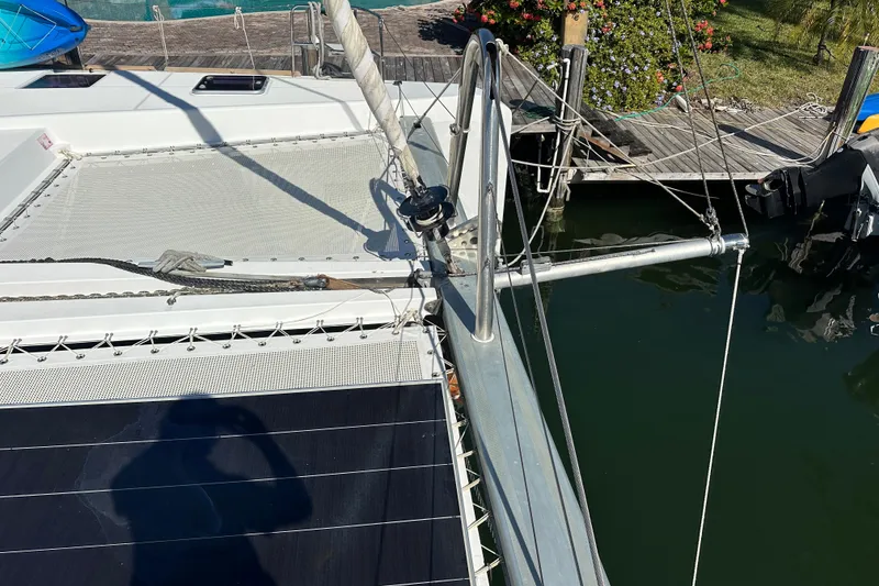 Slide: The Image of 2017 Lagoon 52 F catamaran docked, showcasing deck and rigging details. - 11