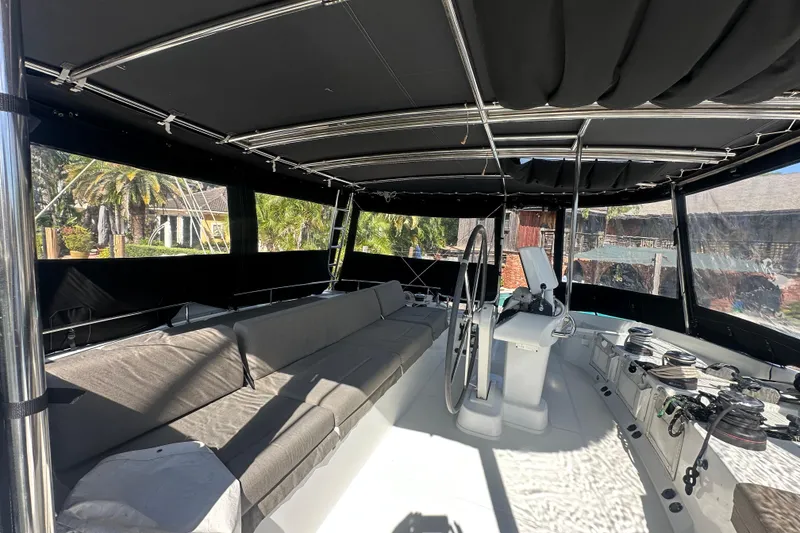Slide: The Image of Spacious cockpit of 2017 Lagoon 52 F catamaran with seating and helm station. - 12