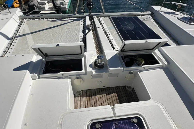 Slide: The Image of 2017 Lagoon 52 F catamaran deck with open storage compartments and solar panel. - 13