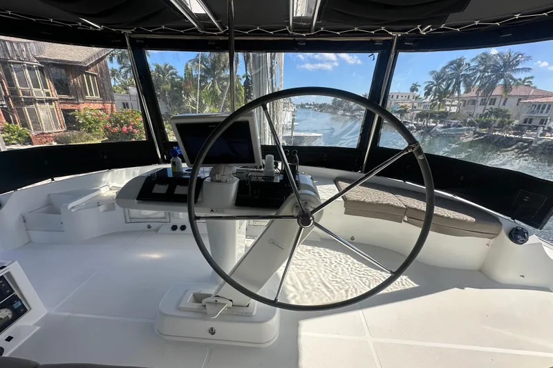 Slide: The Image of Helm of 2017 Lagoon 52 F catamaran with panoramic marina view. - 15