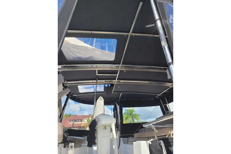 Slide: The Image of 2017 Lagoon 52 F yacht interior with sleek black canopy and modern design elements. - 16