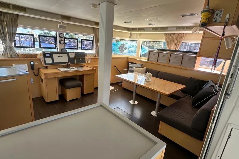Slide: The Image of Luxurious interior of 2017 Lagoon 52 F catamaran with modern navigation station and seating area. - 22