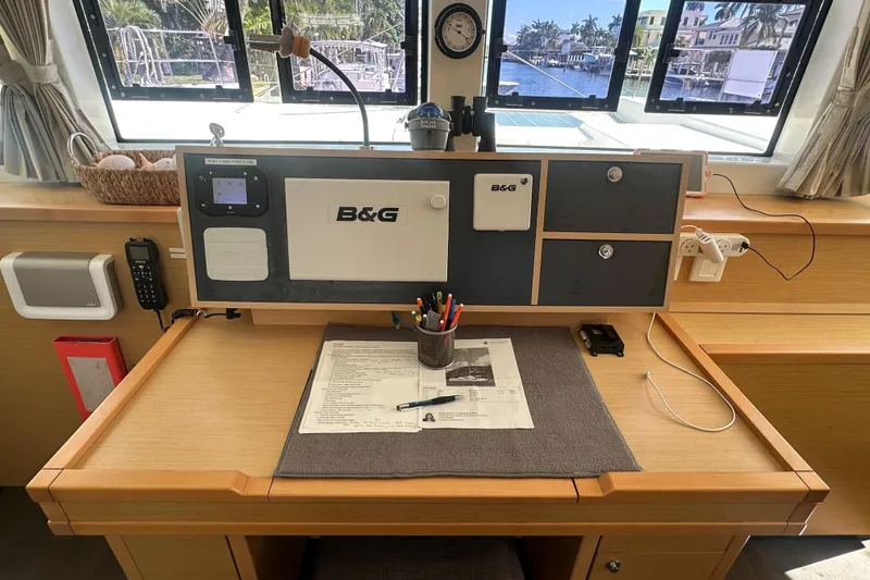 Slide: The Image of Navigation station on 2017 Lagoon 52 F catamaran with B&G equipment and scenic window view. - 28