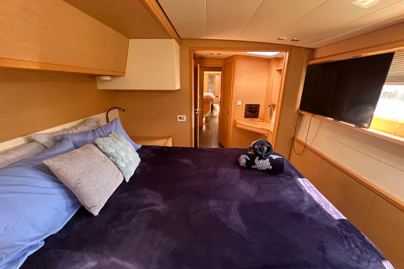 Slide: The Image of Luxurious cabin interior of 2017 Lagoon 52 F yacht with cozy bedding and modern amenities. - 29