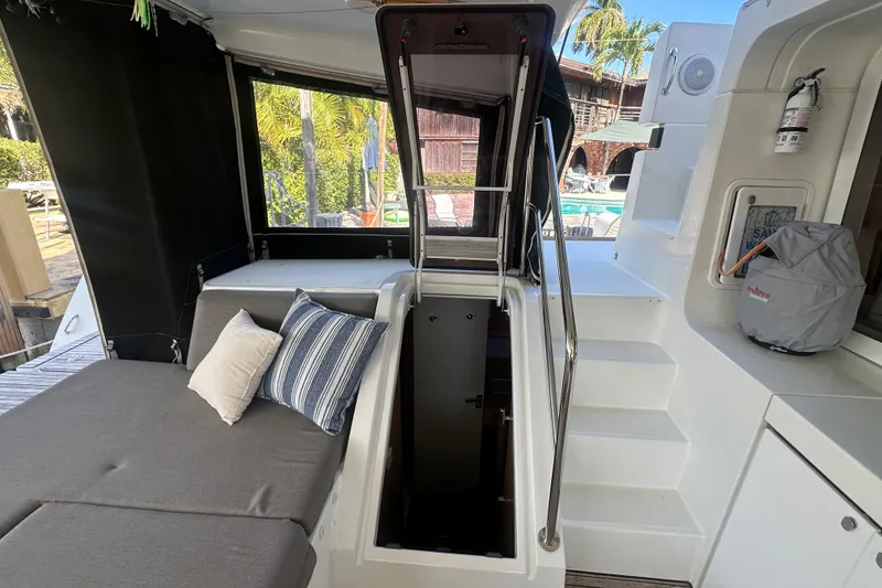 Slide: The Image of 2017 Lagoon 52 F yacht interior with seating, cushions, and open hatch. - 33