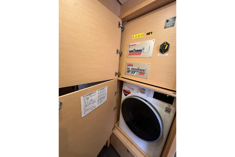 Slide: The Image of Laundry area with control panels in 2017 Lagoon 52 F yacht. - 40