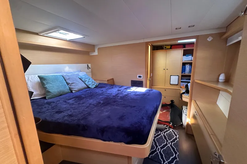 Slide: The Image of Luxurious cabin interior of 2017 Lagoon 52 F yacht with cozy bedding and ample storage. - 44
