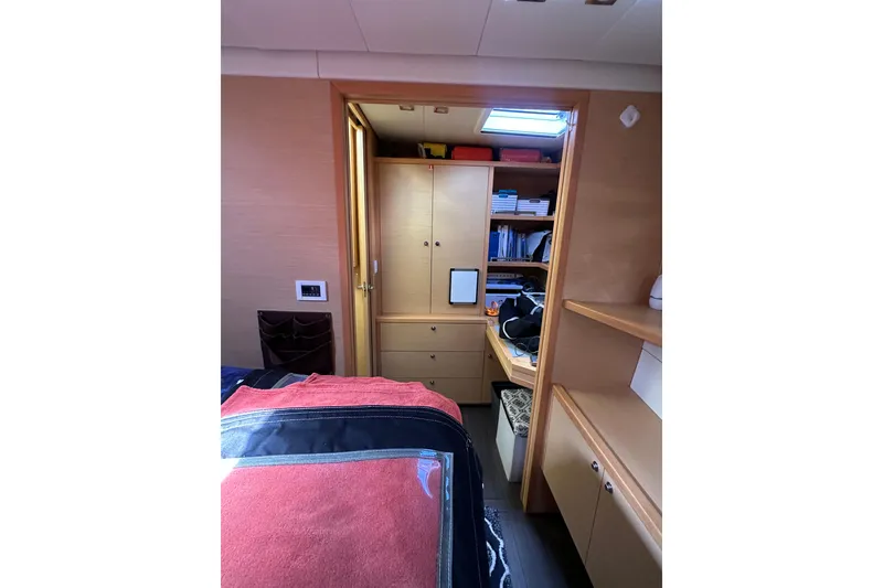 Slide: The Image of Interior cabin of 2017 Lagoon 52 F yacht with wooden cabinetry and storage. - 47