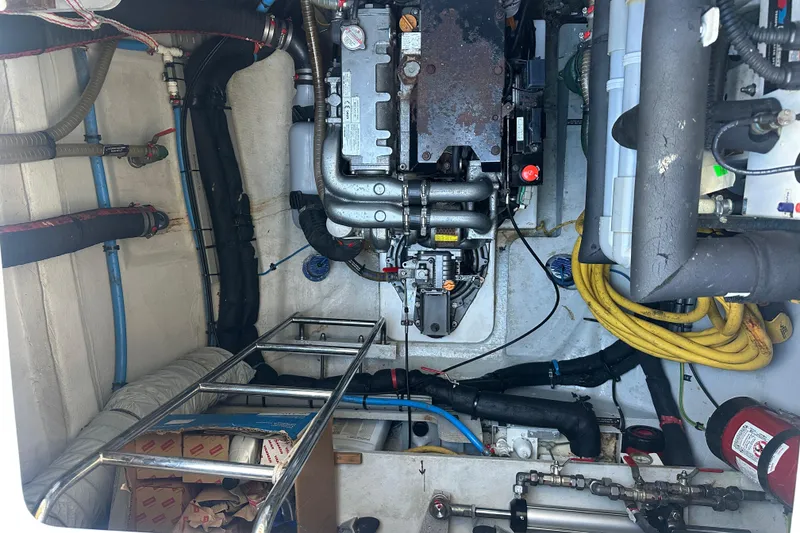 Slide: The Image of Engine room of a 2017 Lagoon 52 F catamaran with visible machinery and equipment. - 53