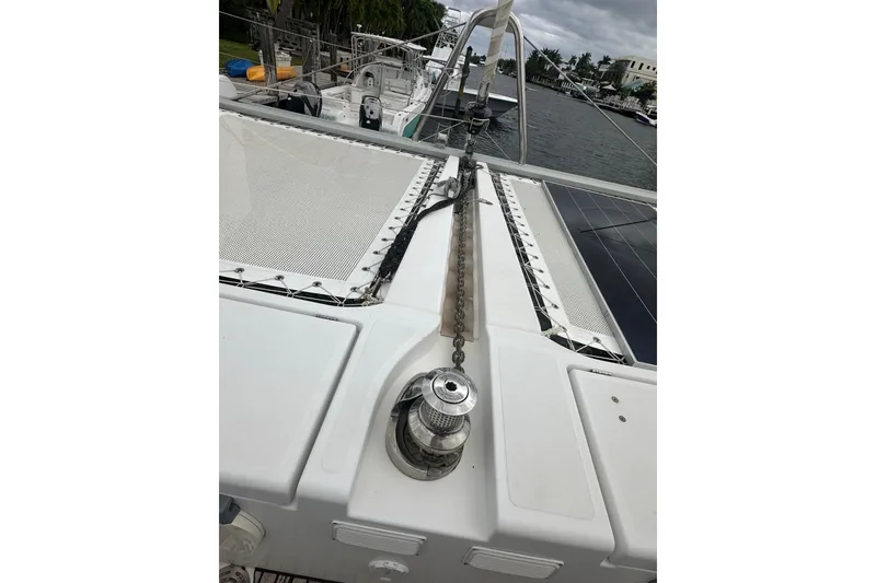 Slide: The Image of 2017 Lagoon 52 F catamaran deck with anchor chain and winch. - 6