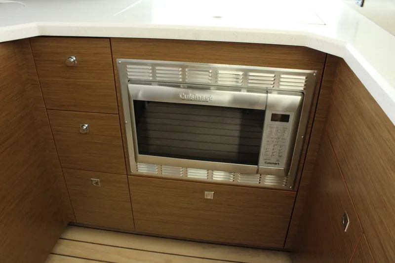 Slide: The Image of 2014 Cruisers Yachts 45 Cantius kitchen area with microwave. - 19