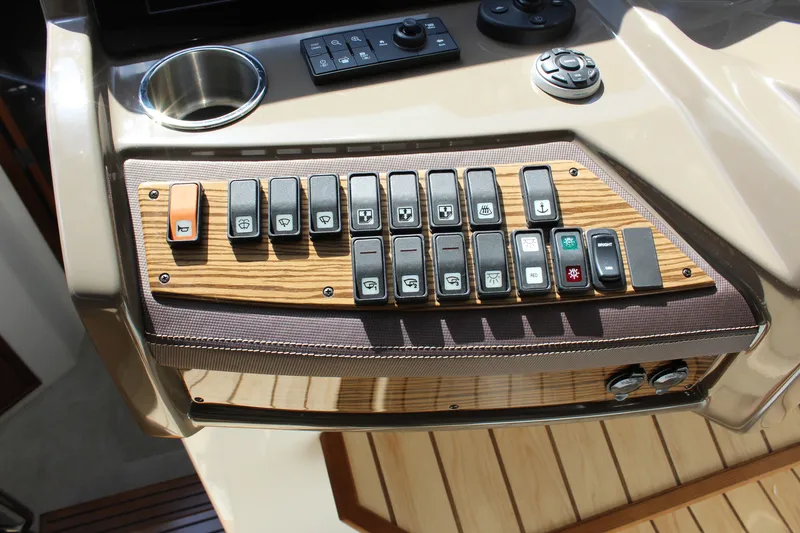 Slide: The Image of 2014 Cruisers Yachts 45 Cantius dashboard with control switches. - 29