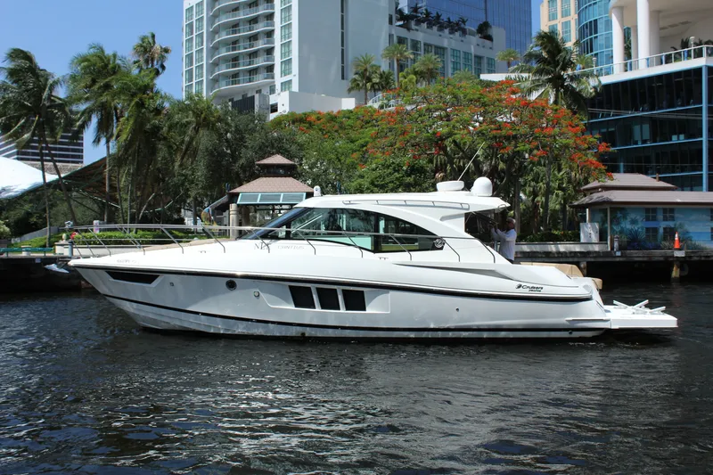 Slide: The Image of 2014 Cruisers Yachts 45 Cantius on a waterway with skyscrapers in the background. - 4