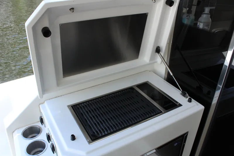 Slide: The Image of Grill area on a 2014 Cruisers Yachts 45 Cantius. - 10