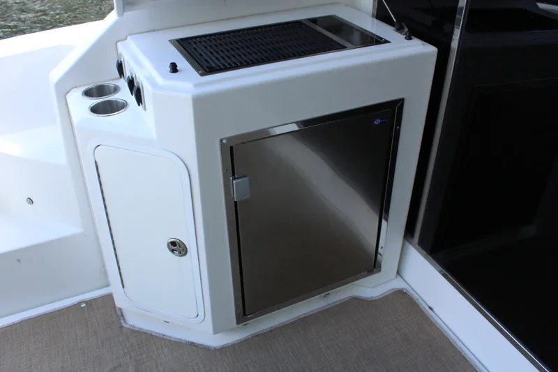 Slide: The Image of 2014 Cruisers Yachts 45 Cantius kitchen area with stainless steel fridge. - 12