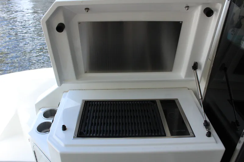 Slide: The Image of Grill area on a 2014 Cruisers Yachts 45 Cantius boat. - 9