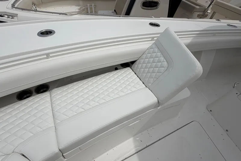 Slide: The Image of 2026 Regulator 28 boat with luxurious white quilted seating. - 10
