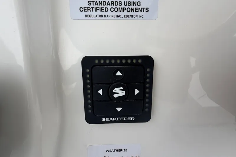 Slide: The Image of Control panel on a 2026 Regulator 28 boat featuring Seakeeper stabilization system. - 19