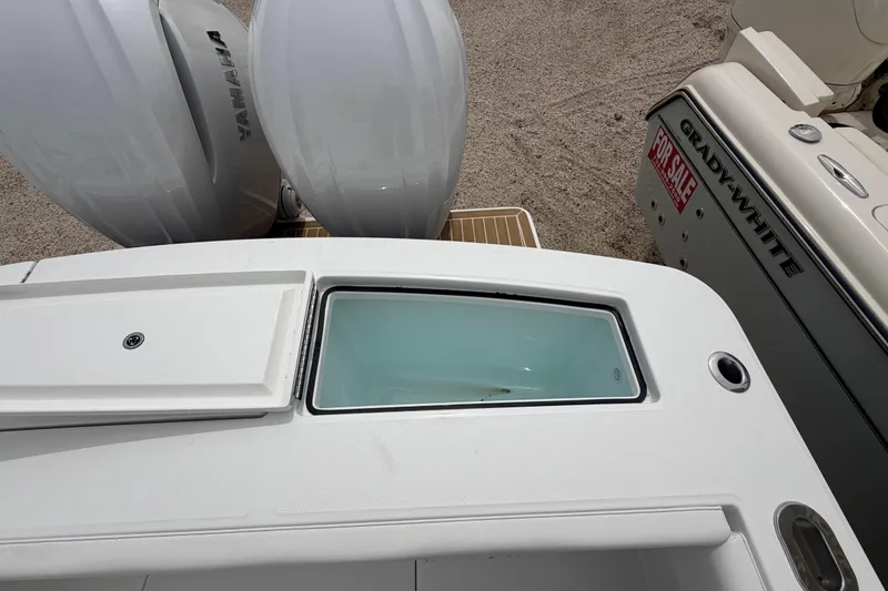 Slide: The Image of 2026 Regulator 28 boat with Yamaha engines and Grady-White for sale sign. - 29