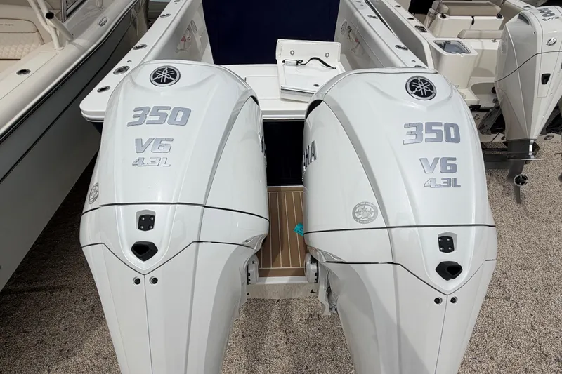 Slide: The Image of Twin Yamaha 350 V6 outboard engines on a 2026 Regulator 28 boat. - 30