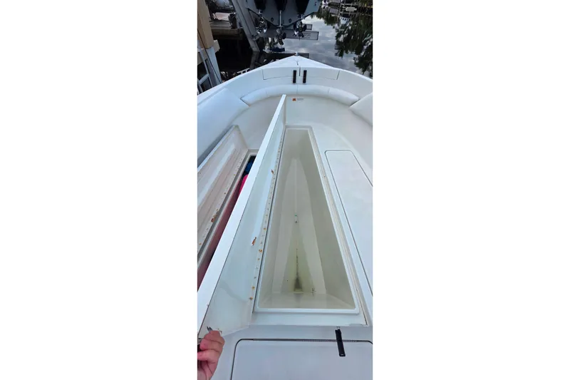 Slide: The Image of 1999 Hydra-Sports 3000 CC boat with open storage compartment on deck. - 15