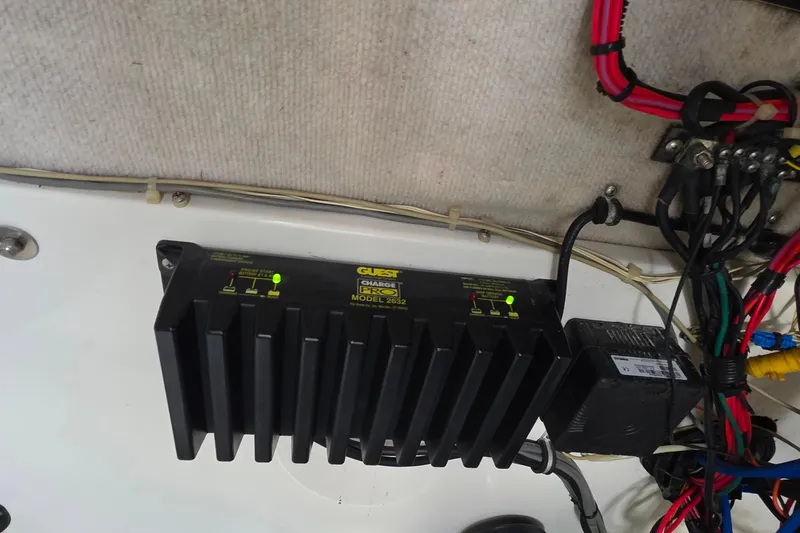 Slide: The Image of Battery charger setup in a 1999 Hydra-Sports 3000 CC boat, featuring wiring and connections. - 17