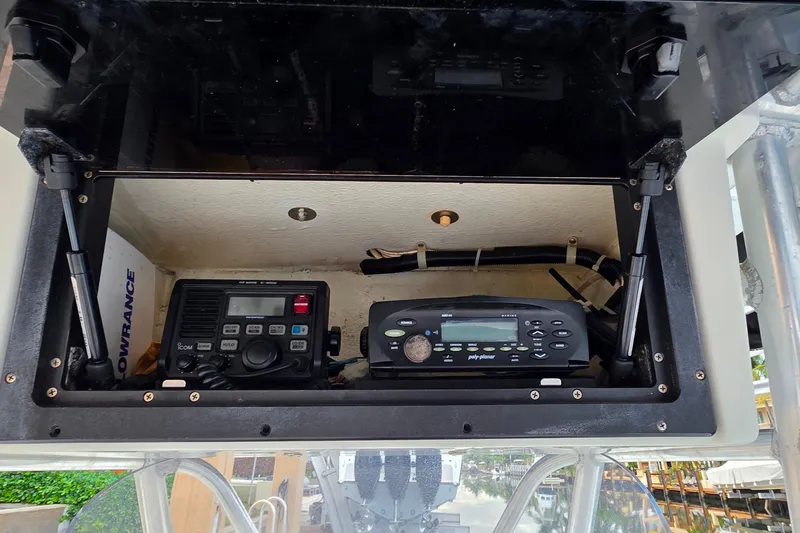 Slide: The Image of 1999 Hydra-Sports 3000 CC boat electronics compartment with communication and navigation equipment. - 21