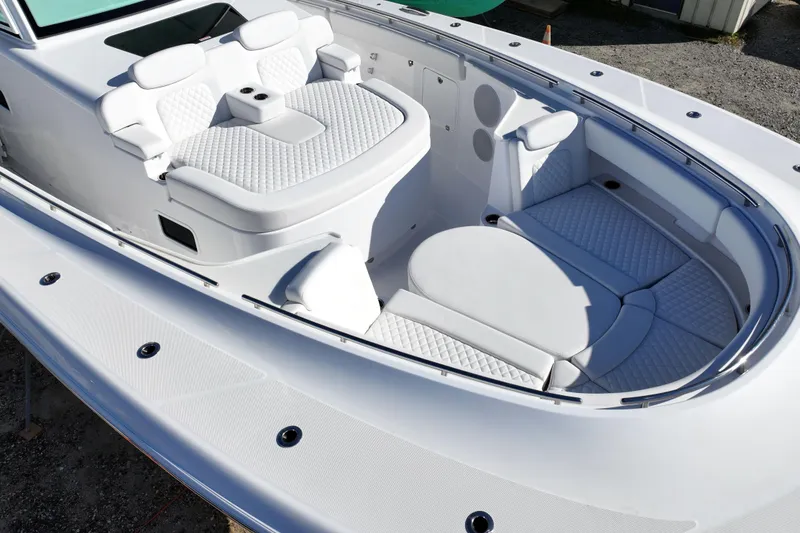 Slide: The Image of Luxurious seating area on 2026 HCB 48 Campeon boat, featuring elegant white upholstery. - 12