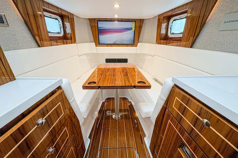 Slide: The Image of Manufacturer Provided Image: Luxurious interior of 2026 HCB 48 Campeon yacht with elegant wood finishes and seating. - 16