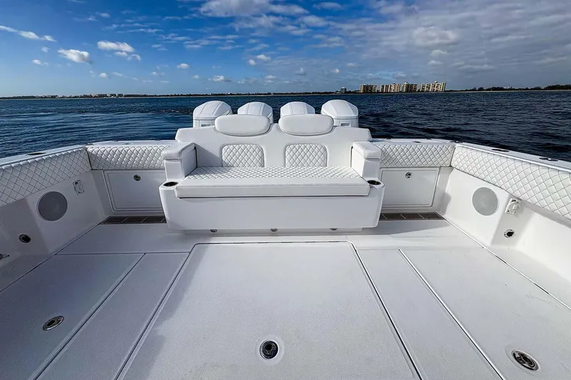 Slide: The Image of Manufacturer Provided Image: Luxurious seating on 2026 HCB 48 Campeon boat, with ocean view and clear sky. - 18