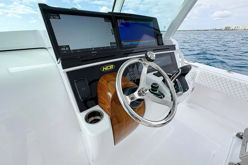 Slide: The Image of Manufacturer Provided Image: Helm of 2026 HCB 48 Campeon boat with advanced navigation displays and controls. - 22