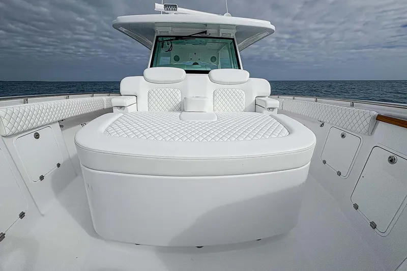 Slide: The Image of Manufacturer Provided Image: Luxurious 2026 HCB 48 Campeon boat interior with plush white seating and ocean backdrop. - 34