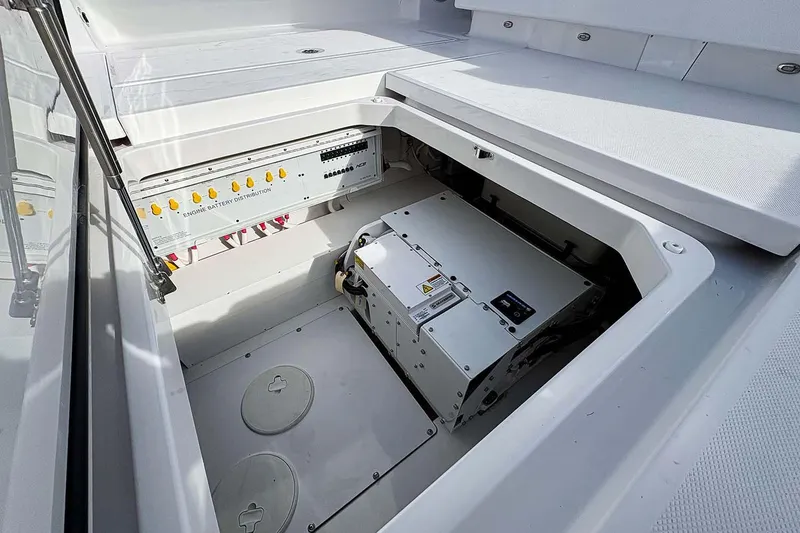 Slide: The Image of Manufacturer Provided Image: Engine battery compartment of 2026 HCB 48 Campeon boat, showcasing distribution panel. - 35