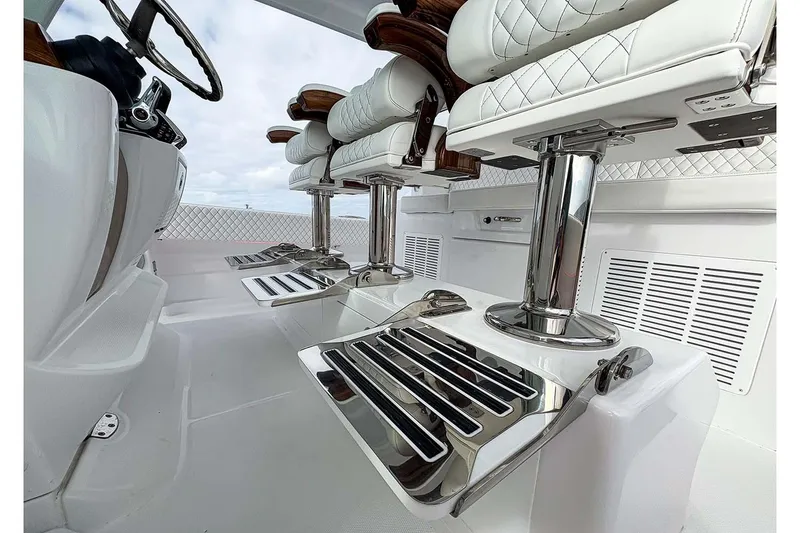 Slide: The Image of Manufacturer Provided Image: Luxurious interior of 2026 HCB 48 Campeon boat with sleek seating and chrome accents. - 36