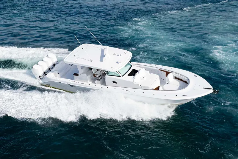 Slide: The Image of Manufacturer Provided Image: 2026 HCB 48 Campeon boat cruising on open water, showcasing sleek design and powerful engines. - 41