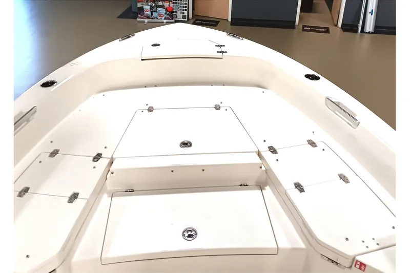 Slide: The Image of 2026 Pathfinder 2400 TRS boat interior with storage compartments and sleek design. - 12