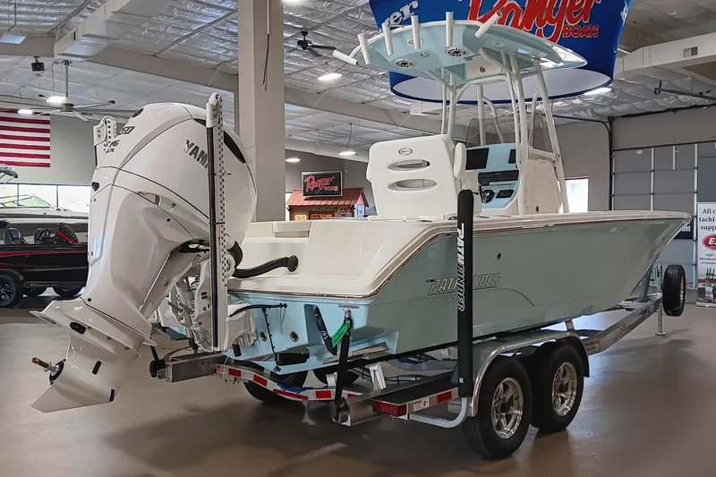 Slide: The Image of 2026 Pathfinder 2400 TRS boat with Yamaha engine on trailer in showroom. - 5