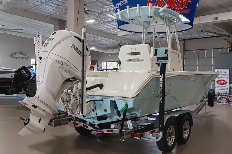 Slide: The Image of 2026 Pathfinder 2400 TRS boat with Yamaha engine on display in showroom. - 8